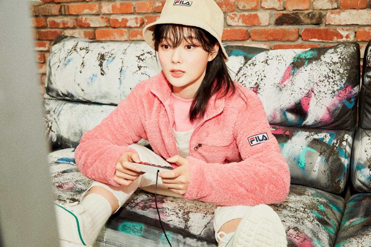 korean actress kim Yoo-jung modeling fila by playing video game and wearing fila jacket and cream color corduroy bucket hat