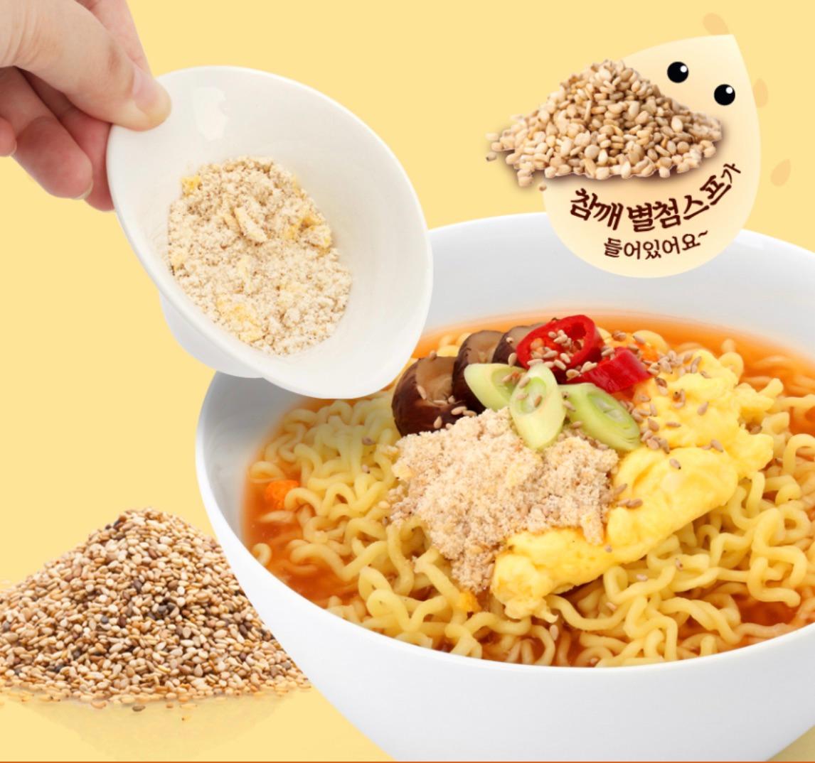 korean brand paldo Sesame Ramen ad of pouring a bowl of sesame seed into bowl of ramen 