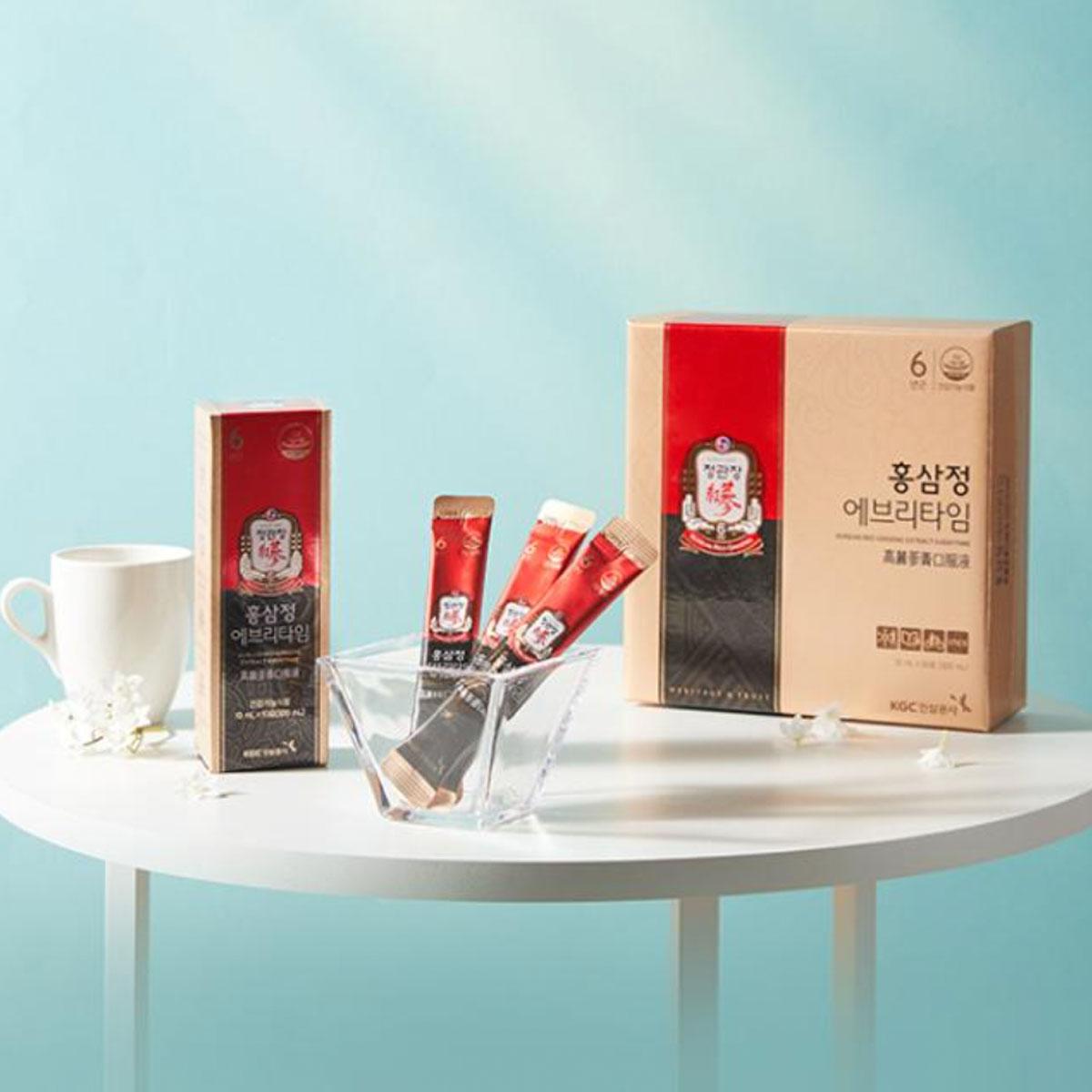 korean brand cheong kwan jang red ginseng extract everytime set on display with blue background 