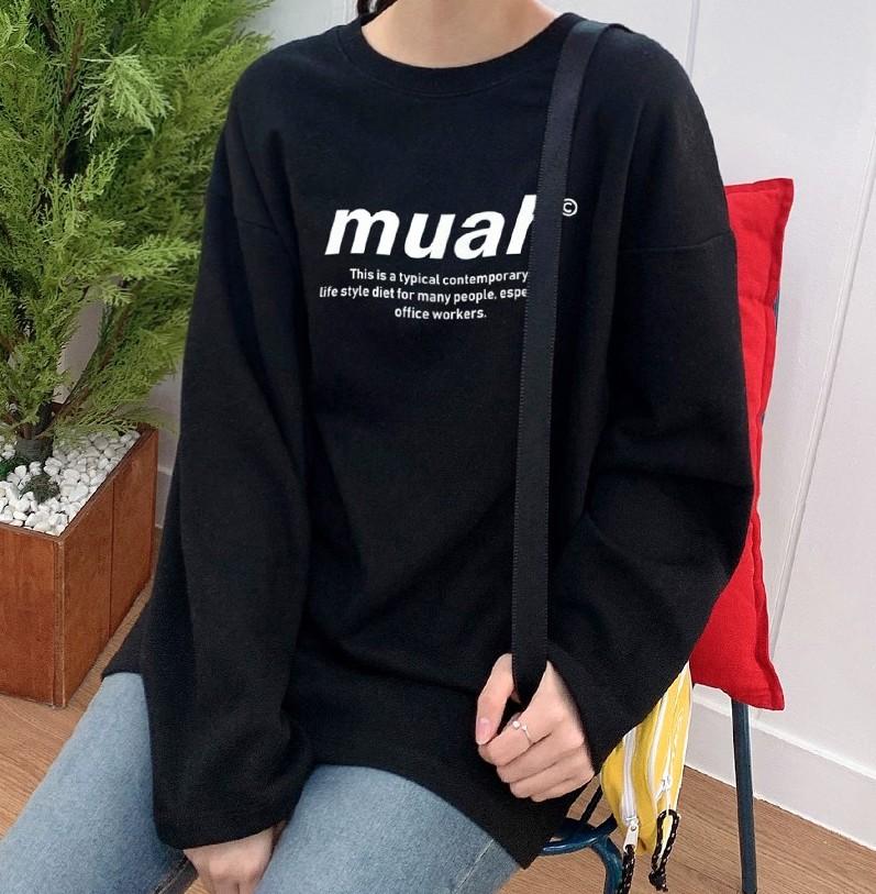 korean brand muah muah Signature Graphic T-Shirt in black worn by close up of shirt on model with yellow bag sitting on chair with red pillow 