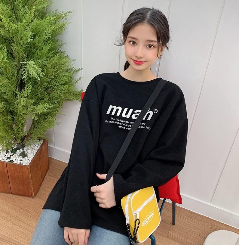 korean brand muah muah Signature Graphic T-Shirt in black worn by model with yellow bag
